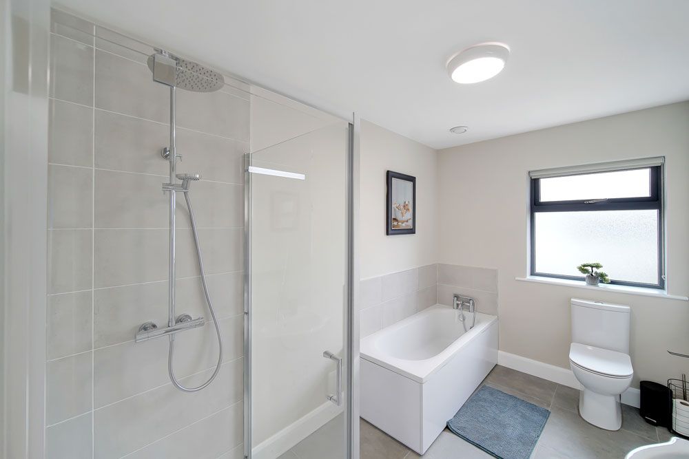 First floor WC, WHB, bath and separate shower